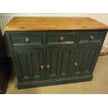 A painted pine cupboard with three drawe