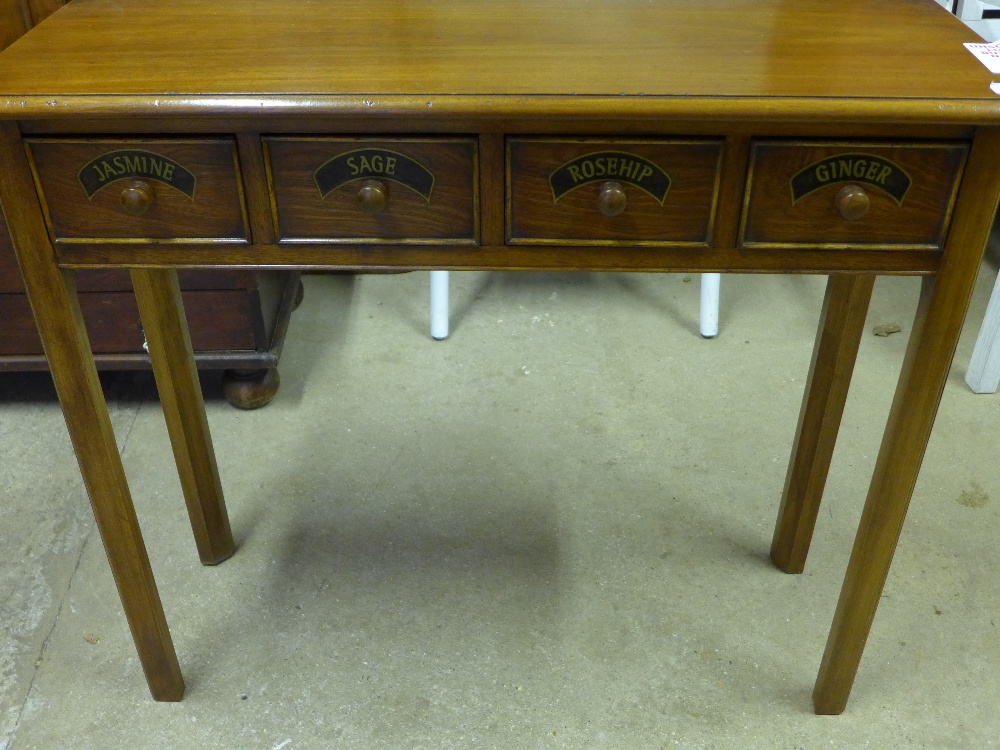 A modern four drawer table with four spi