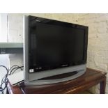 A Samsung 26" L C D  flat screen TV