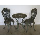 A modern cast iron garden table with two