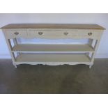 A painted dresser base with three drawer