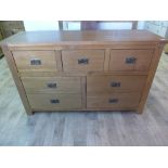 An oak ex display seven drawer wide ches