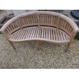 A Bramblecrest teak Banana bench - damaged back