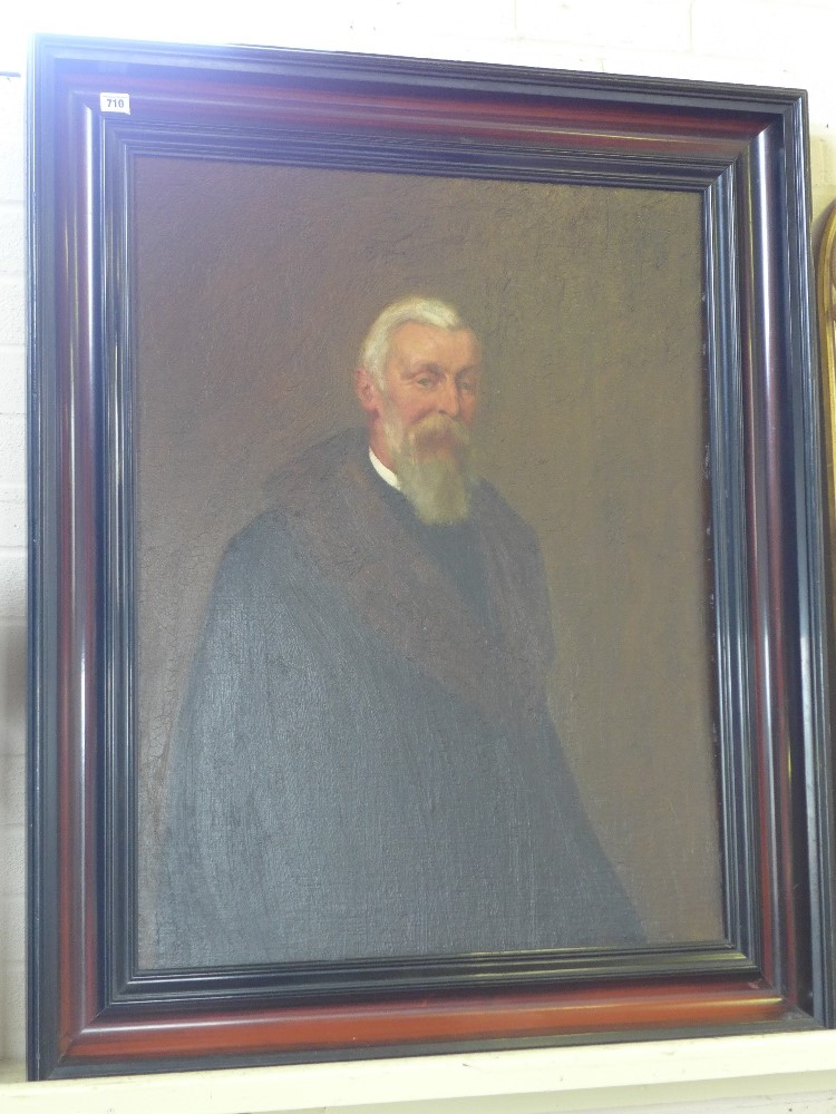 An oil on board portrait of a Vicar in a