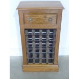 A new oak 24 bottle wine rack with a dra