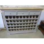 A new painted wine rack holding 50 bottl