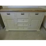 A new hardwood painted sideboard with a