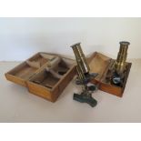 Two boxed brass field or student Microsc