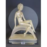 An Art Deco later plaster lady on a late