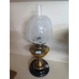 An Edwardian brass oil lamp with an opaq