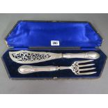 A boxed silver slice and fork - Length 3