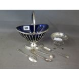 A silver basket with blue glass liner - London 1919  C & S Co Ltd and a small silver stand, two