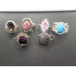 Six gem-set rings - All with marks indic