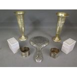 Two boxed silver napkin rings, a pair of