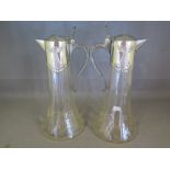 A pair of WMF glass claret jugs with pla