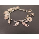 A silver charm bracelet - The curb-link