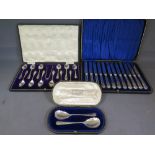 A boxed set of twelve cake knives with s