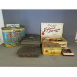 A collection of assorted advertising tin