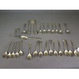 A collection of assorted silver spoons a