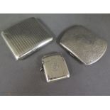 Two silver cigarette cases and a silver