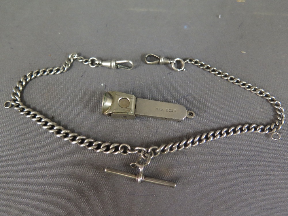 A silver cheroot cutter and silver watch