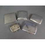 Four silver cigarette cases and a purse