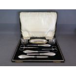 A cased silver nine piece manicure set -