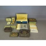 A collection of thirteen vintage cigarette tins and packets some with contents