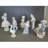 A group of three Lladro and four Nao fig