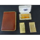 A group of smoking accessories to include a 9 ct gold and Bakelite amber cheroot/cigarette holder