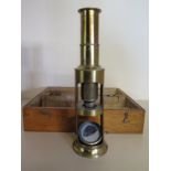 A Student case brass Microscope