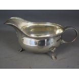 A silver sauce boat with egg and dart mo