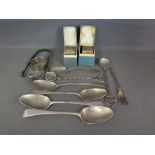 A collection of silverware to include th