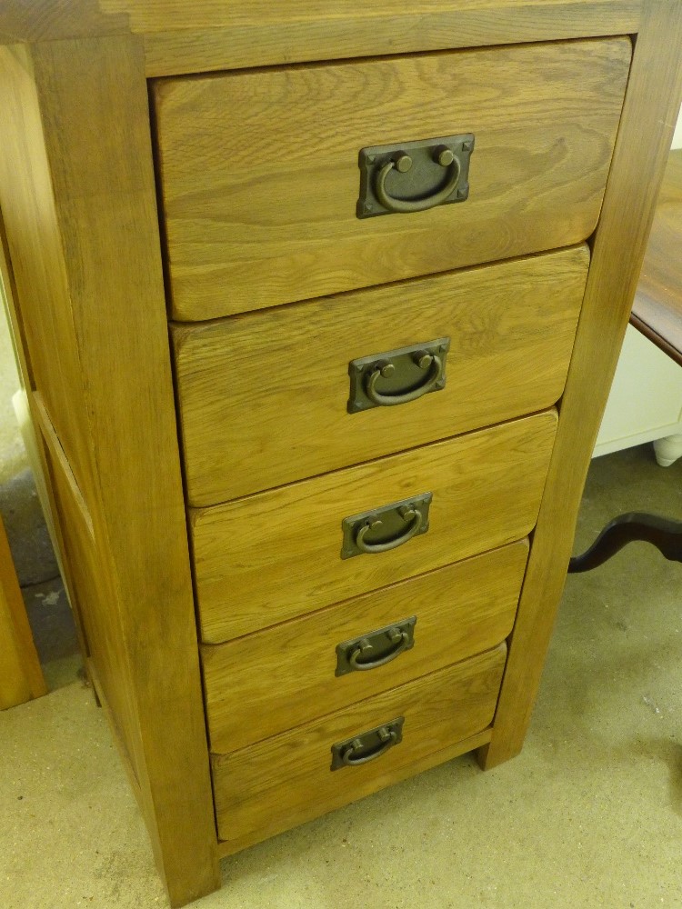 An ex display oak five drawer tallboy - Height 101 cm x Width 57cm x Depth 42cm