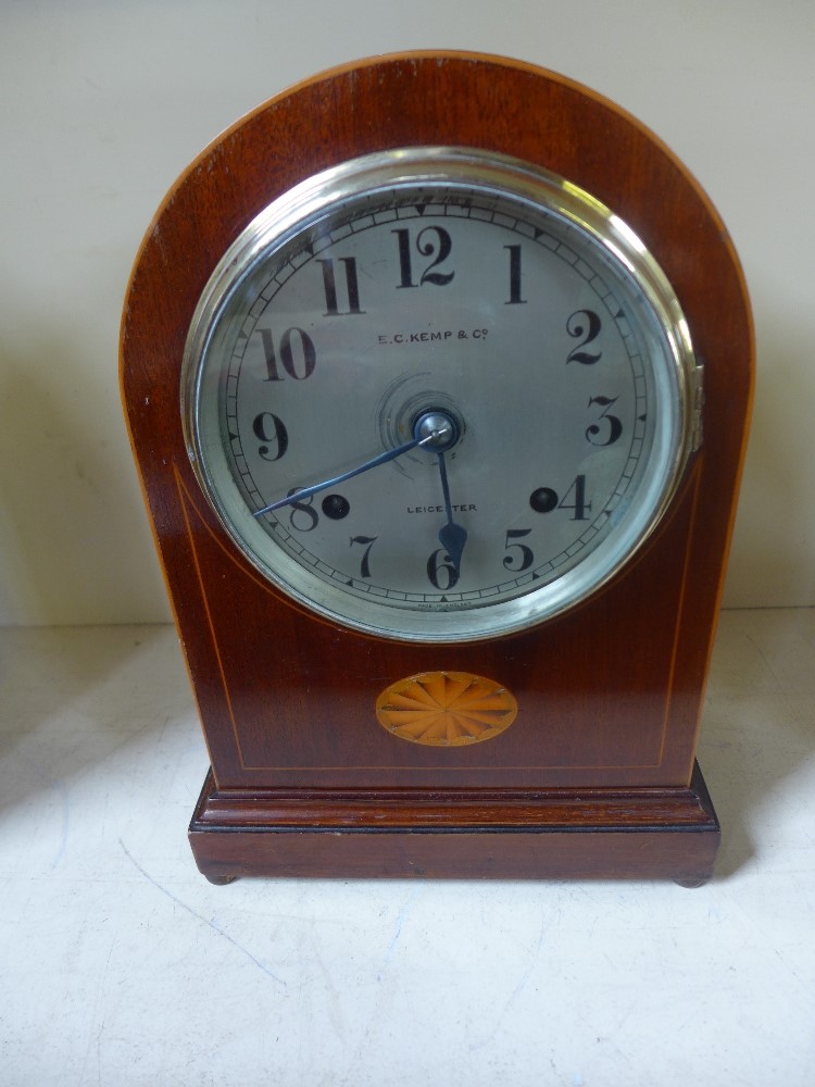 An eight day mahogany with inlay mahogany clock strikes hours/half on coiled gong 
Condition