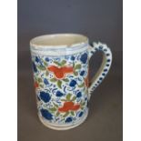 A polychrome cylindrical tin glazed tankard - Height 15 cm 
Condition report: Some frits to rim