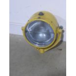 A large yellow painted aluminium landing light by Harley - mounted on a U shape Gimble bracket -