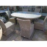 A Bramblecrest Sahara oval table with six chairs - 170 cm x 120 cm - no cushions