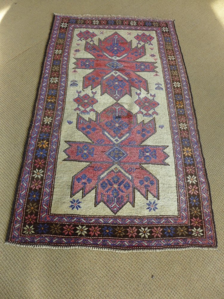 An old Persian rug - 96 cm x 162 cm