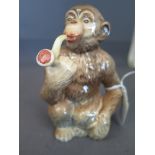 A Beswick comical monkey smoking a pipe - impressed mark 1049 
Condition report: In good condition