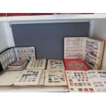 A collection of First Day covers stamps and other stamps in eighteen albums with an album of