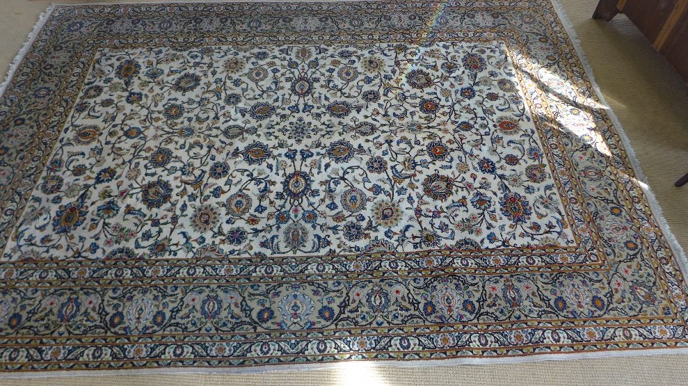 A beige ground very fine handmade Persian Keshan carpet - signed - 3.15 m x 2.25 m