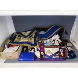 A quantity of Masonic Regalia including sashes, aprons, paperwork, seven silver gilt metal medals