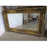 A large ornate Victorian style gilt mirror - 1.55 m x 94 cm