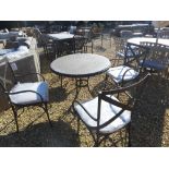 A Bramblecrest Venetian round table 100cm diameter with four metal side chairs