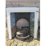 A late Victorian Art Nouveau style cast iron fire surround with original inset tiles