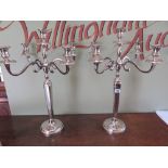 A pair of five light nickel plated candelabra on circular bases - Height 62 cm