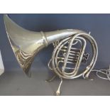 A vintage French horn cleverly converted to a table lamp