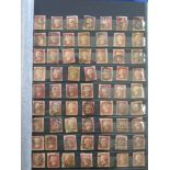 An album of British stamps including over 300 Penny Reds and an album of Queen Elizabeth II stamps