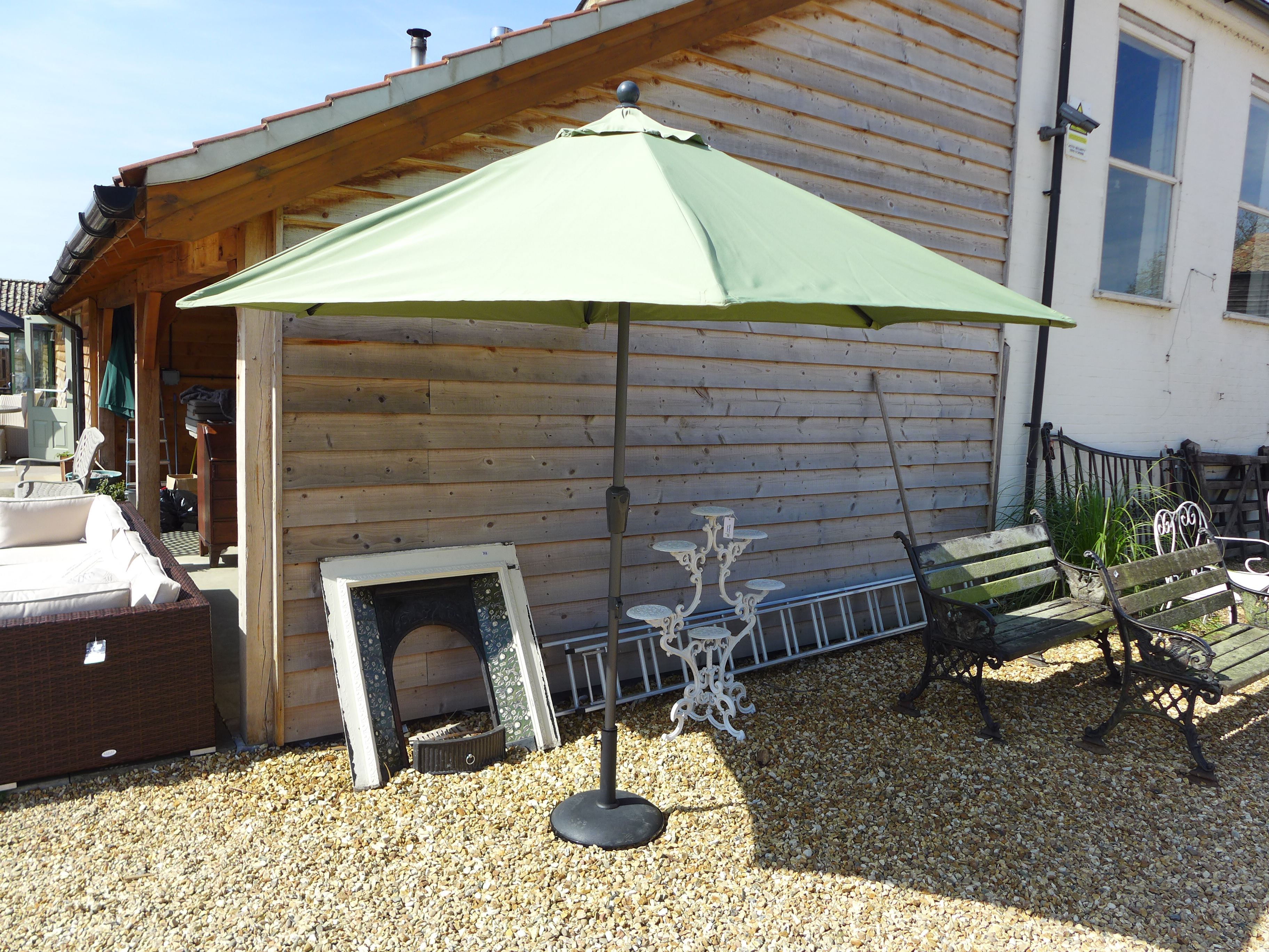 A green parasol and base